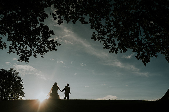 Bride and groom signing marriage certificate at Canada Lake