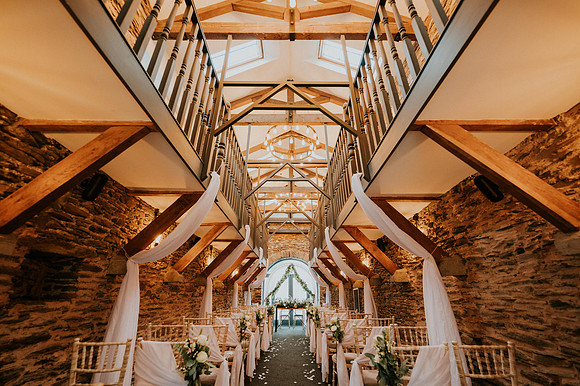 Bride walking down the aisle at Llechwen Hall