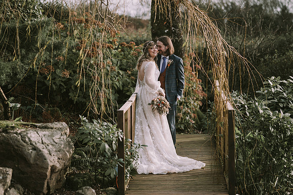 Artistic shot of wedding invitation suite and rings