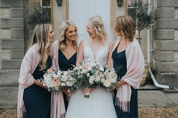 Bride getting ready with bridesmaids