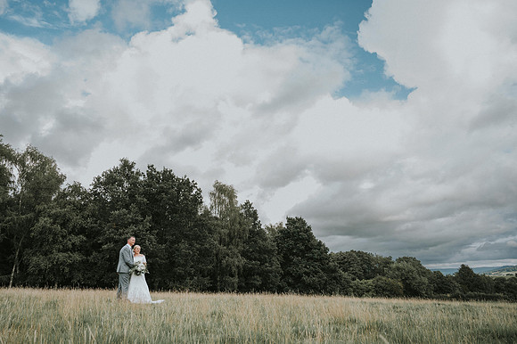 Bride and groom sharing a moment outside Barn at Brynich