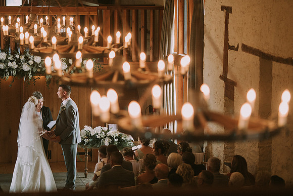 Bride and groom walking hand in hand at Barn at Brynich garden