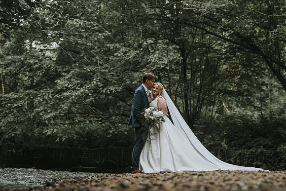The couple under a shower of rose petals.