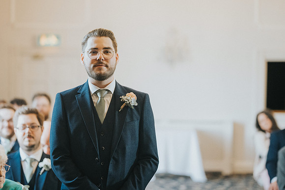 Jon awaiting Laura's arrival at the altar.