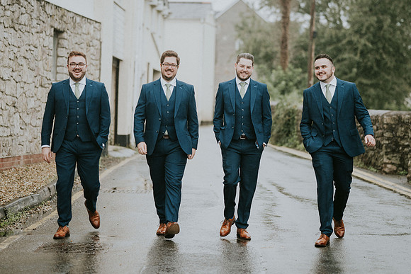 Jon and his groomsmen sharing a moment