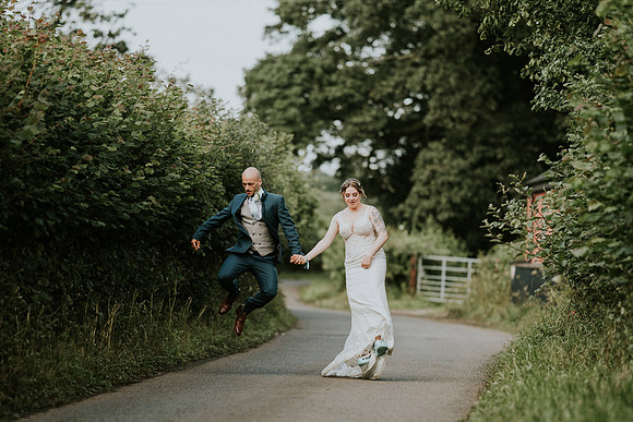 Couple holding hands at Secret Garden wedding