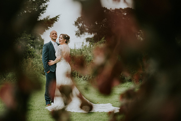 Bride throwing the bouquet at Duffryn Mawr