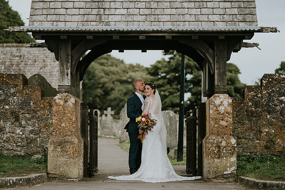 Bride and groom's sweet kiss under the night sky