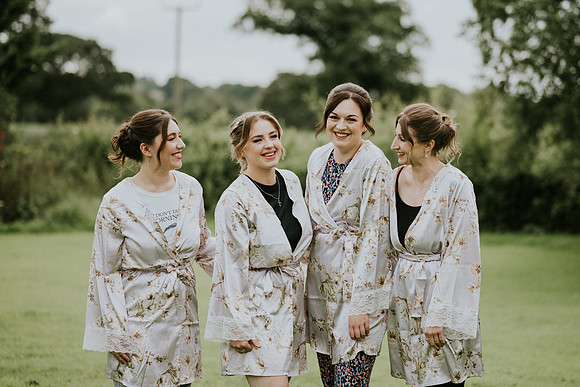 Bridesmaids helping Rosie get ready